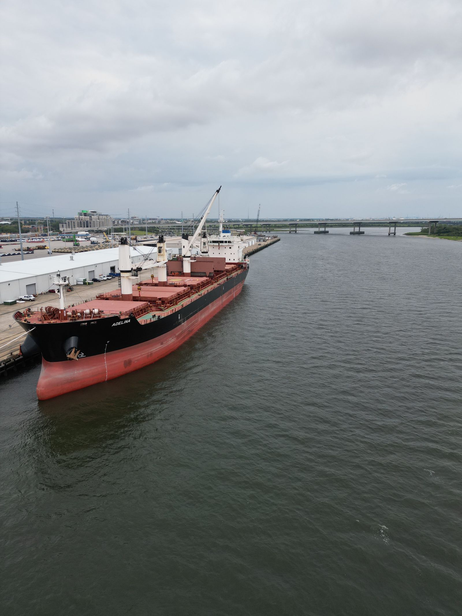 A cargo ship docked at a port terminal