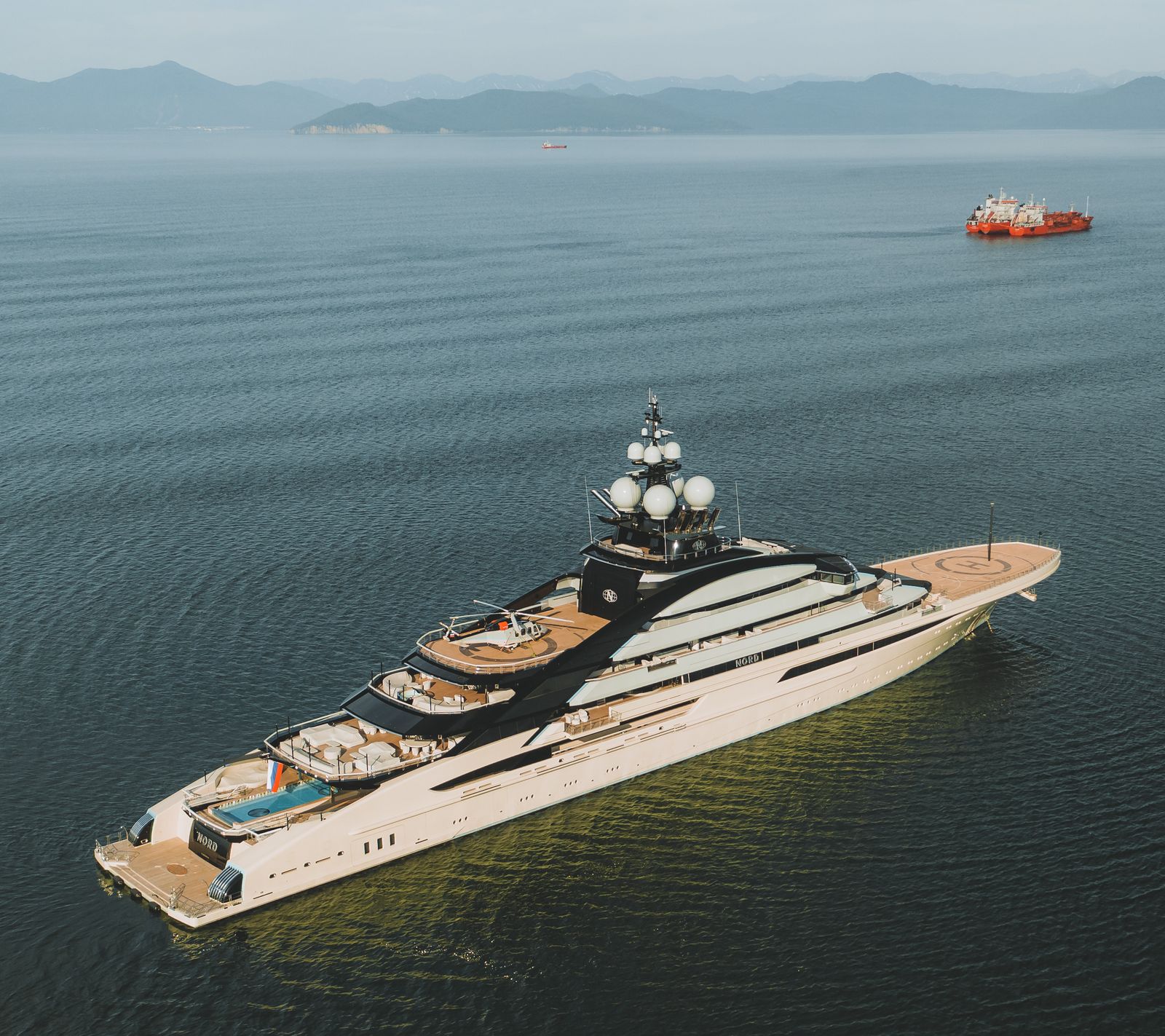 An aerial view of a luxury yacht at sea